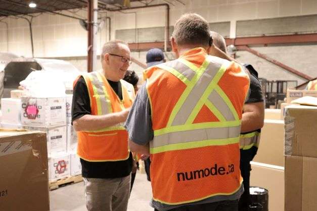Numode employees at a Warehouse